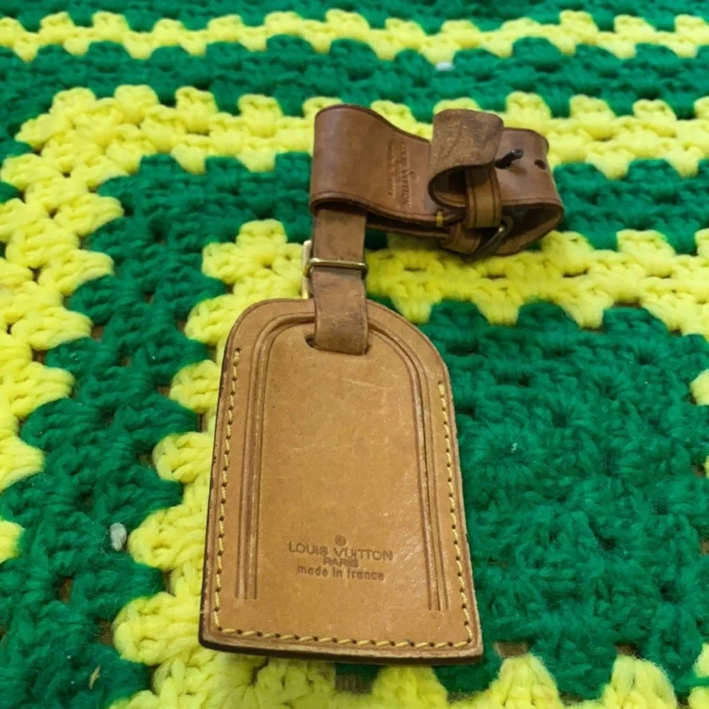 Louis Vuitton luggage tag and poignant